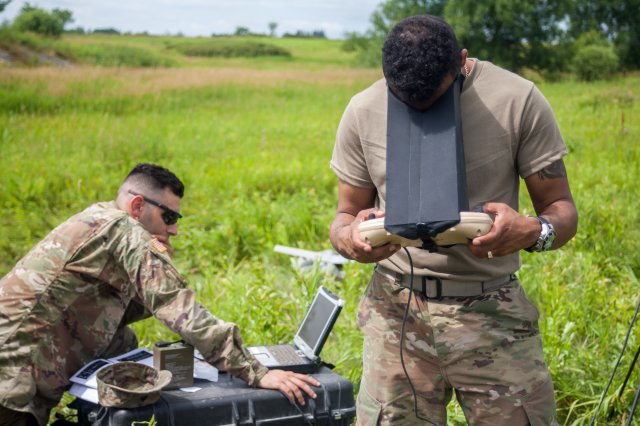 Cpl. Matthew Mena, field artillery tactical data system specialist assigned to Charlie Battery, 1st Battalion, 258th Field Artillery Regiment, launches an RQ-11B Raven small unmanned aircraft system during the unit's annual training at Fort Drum, NY, July 21. During the training, Soldiers across the 27th Infantry Brigade Combat Team were able to log flight time on the Raven to keep their operator certifications current. 