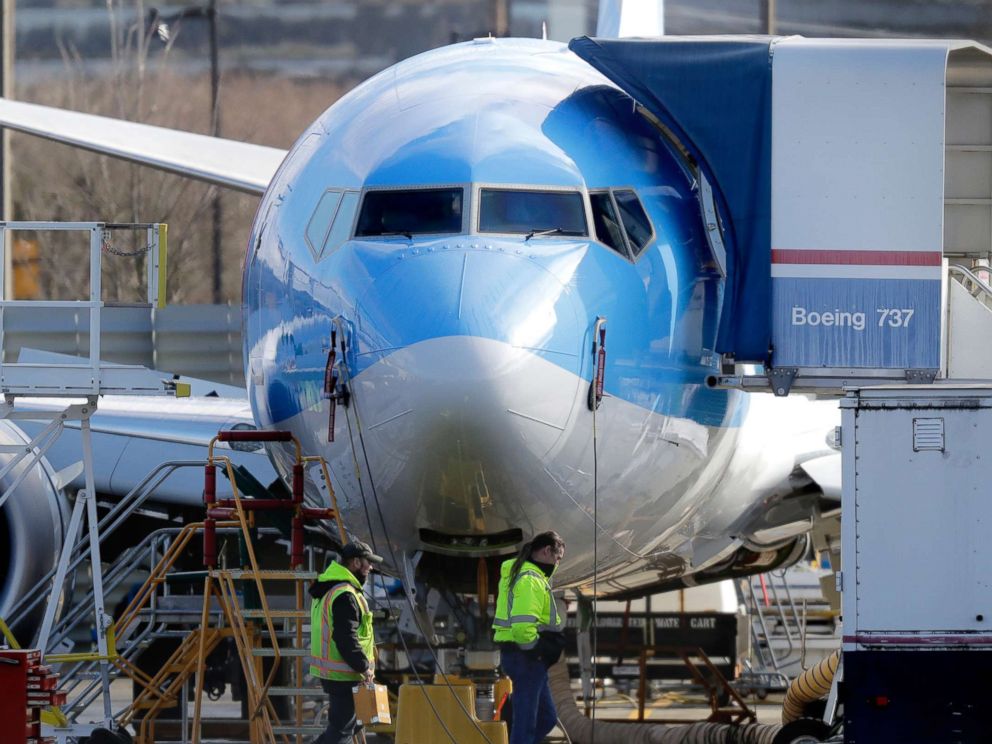 PHOTO: Workers walk past a Boeing 737 MAX 8 airplane being built at Boeing Co.s Renton Assembly Plant Wednesday, March 13, 2019, in Renton, Wash.