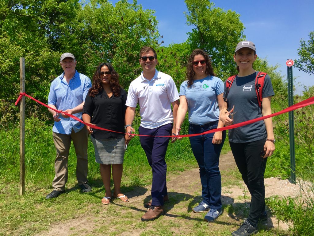 From left, First Deputy Parks Commissioner Liam Kavanagh, state Assemblymember Jaime Williams, Jamaica Bay-Rockaway Parks Conservancys Alex Zablocki, The Nature Conservancys Emily Maxwell and the Natural Areas Conservancys Sarah Charlop-Powers cut the ribbon on a new Marine Park trail. Eagle photo by Lore Croghan
